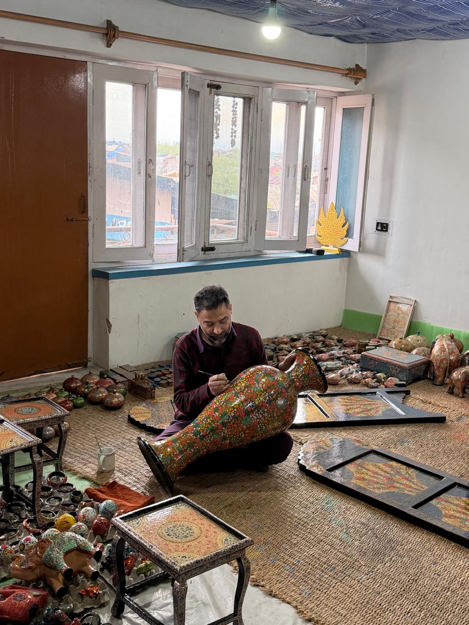 Artisan painting a handcrafted decorative case